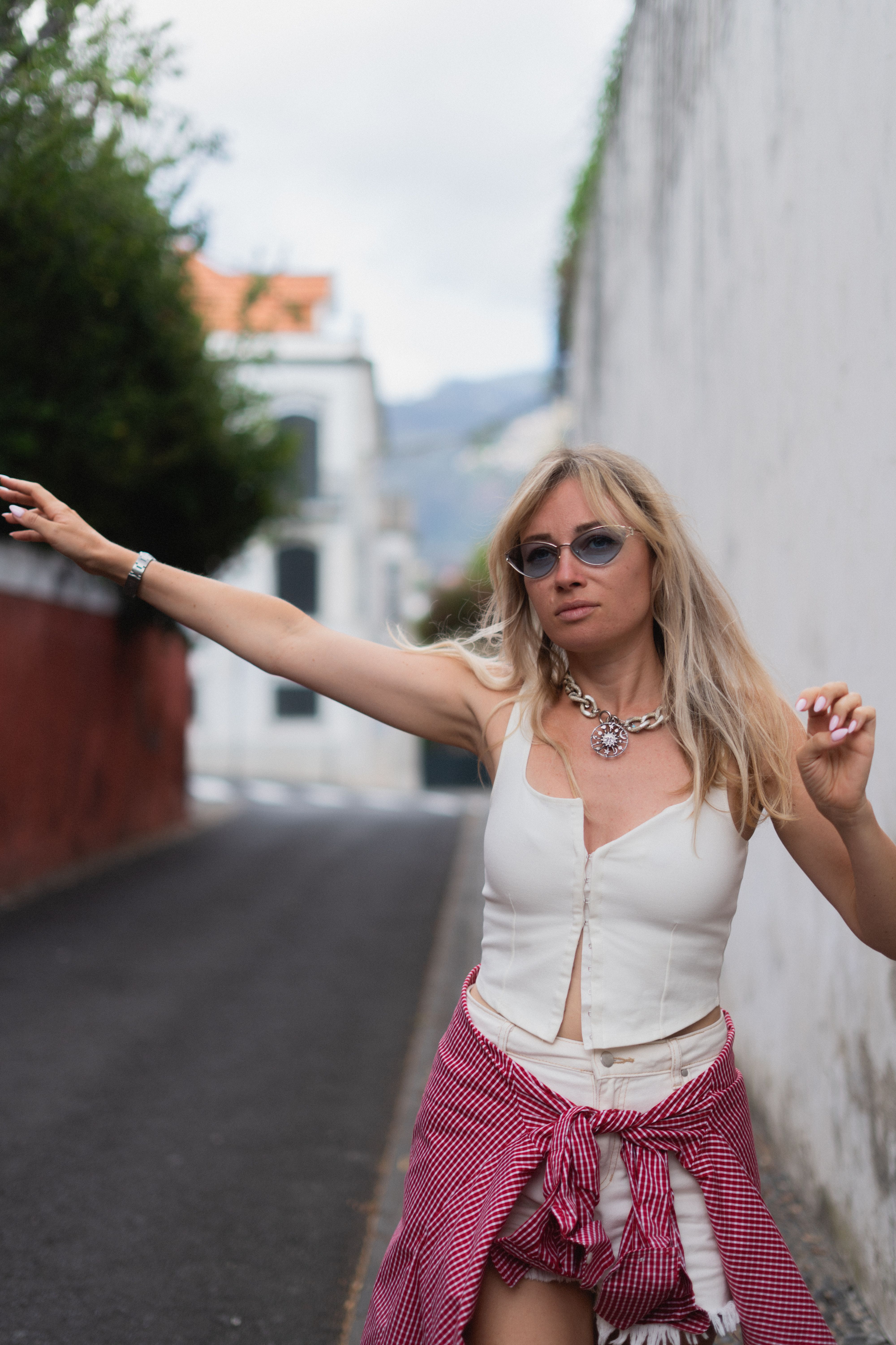 Woman posing on a quiet city street