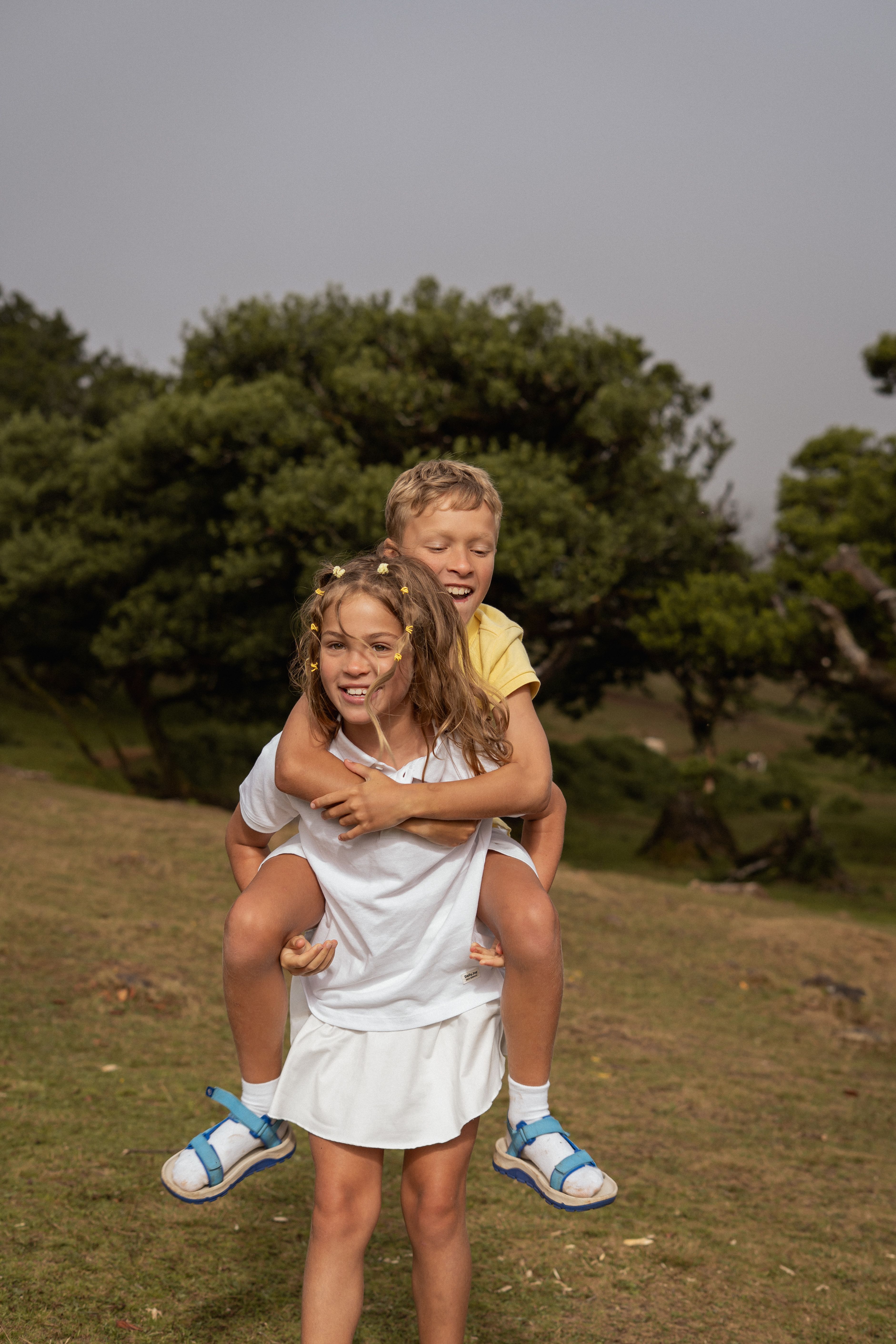Child giving a piggyback ride to another child
